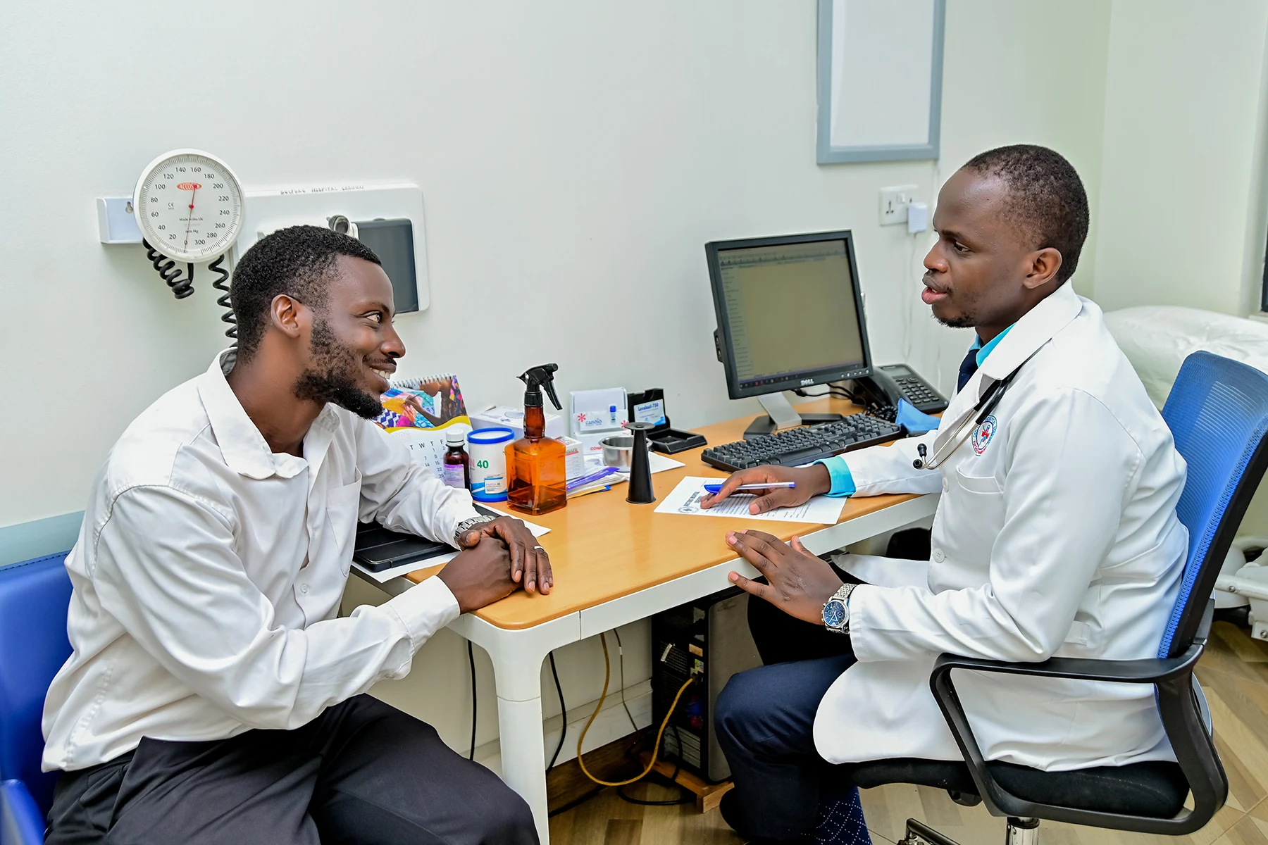 A clinician consulting with a patient at Doctors Hospital Sseguku